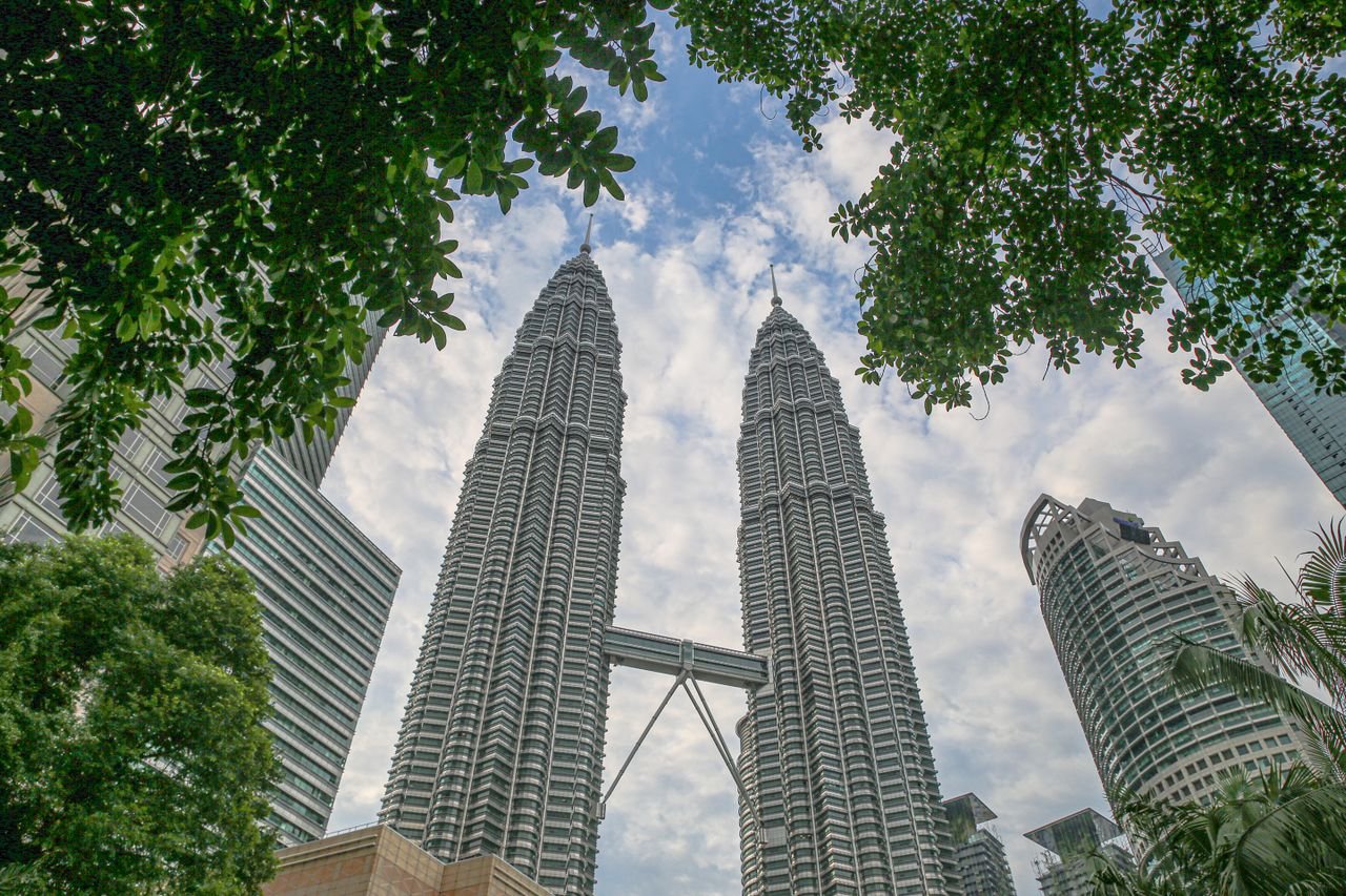 A bustling local street alive with hawker stalls and city life