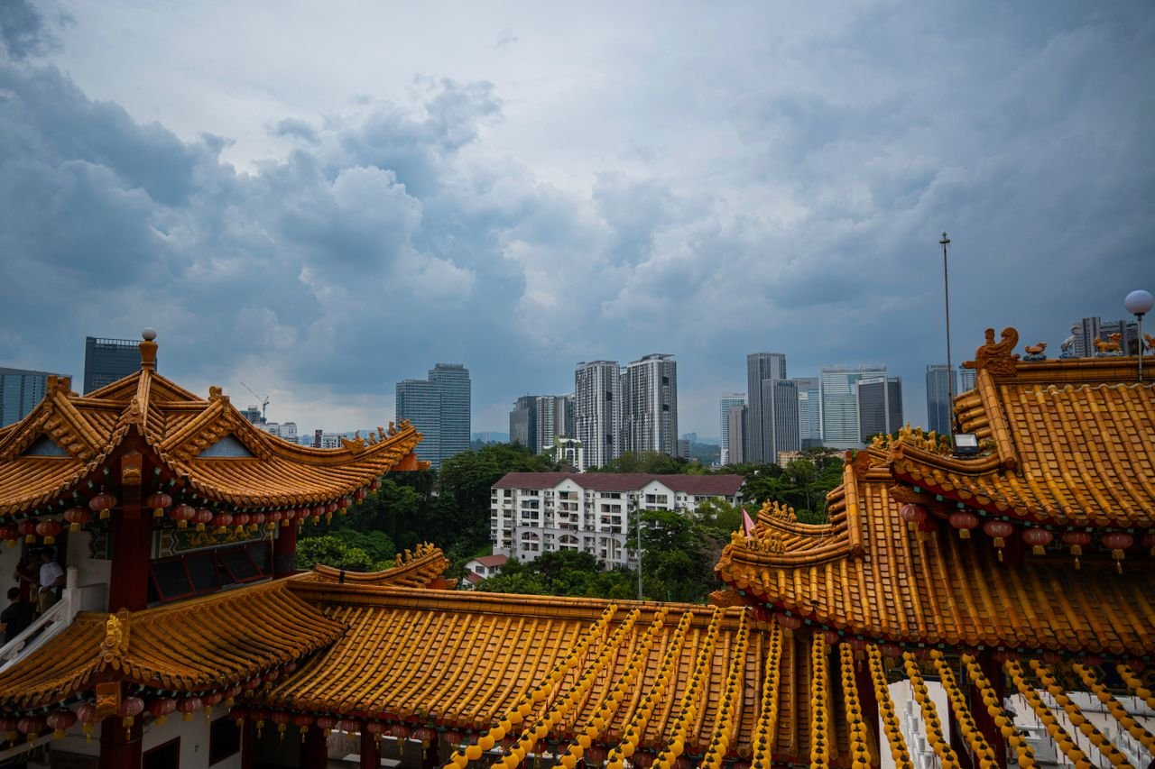 A centuries-old Chinese temple glowing with incense and lanterns